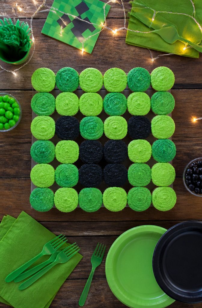 Cupcakes arranged to form a Creeper face, frosted in green.