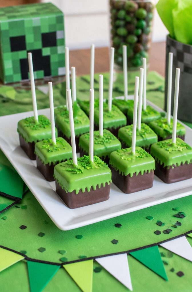Minecraft-themed cake pops arranged on a colorful platter.