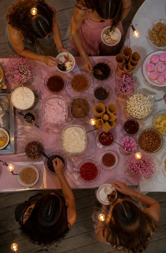 16 Sweet Sixteen Birthday Party Ideas for an Unforgettable Celebration 18 An ice cream sundae station with various toppings set up for guests.